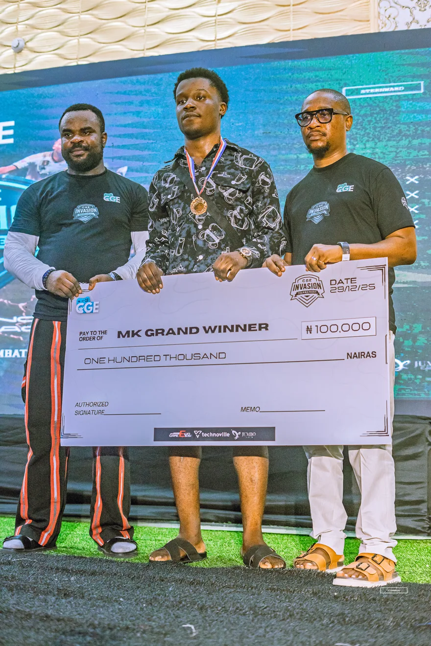 Mortal Kombat grand winner with his one hundred thousand naira cheque